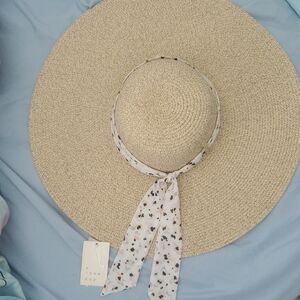 A New Day Tan and White Wide-Brimmed Hat with Polka Dot Ribbon